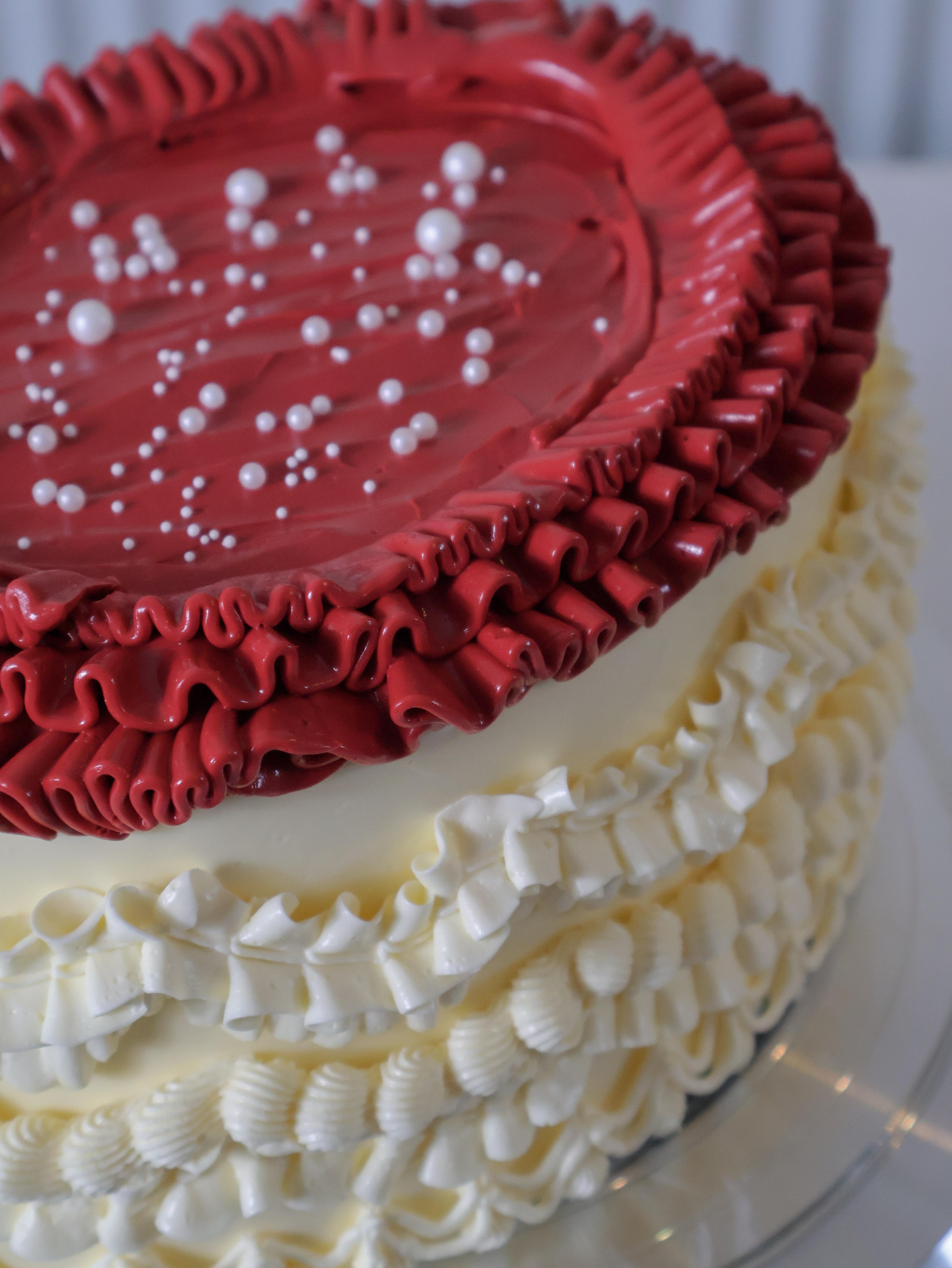 Pale blue heart cake with white piping