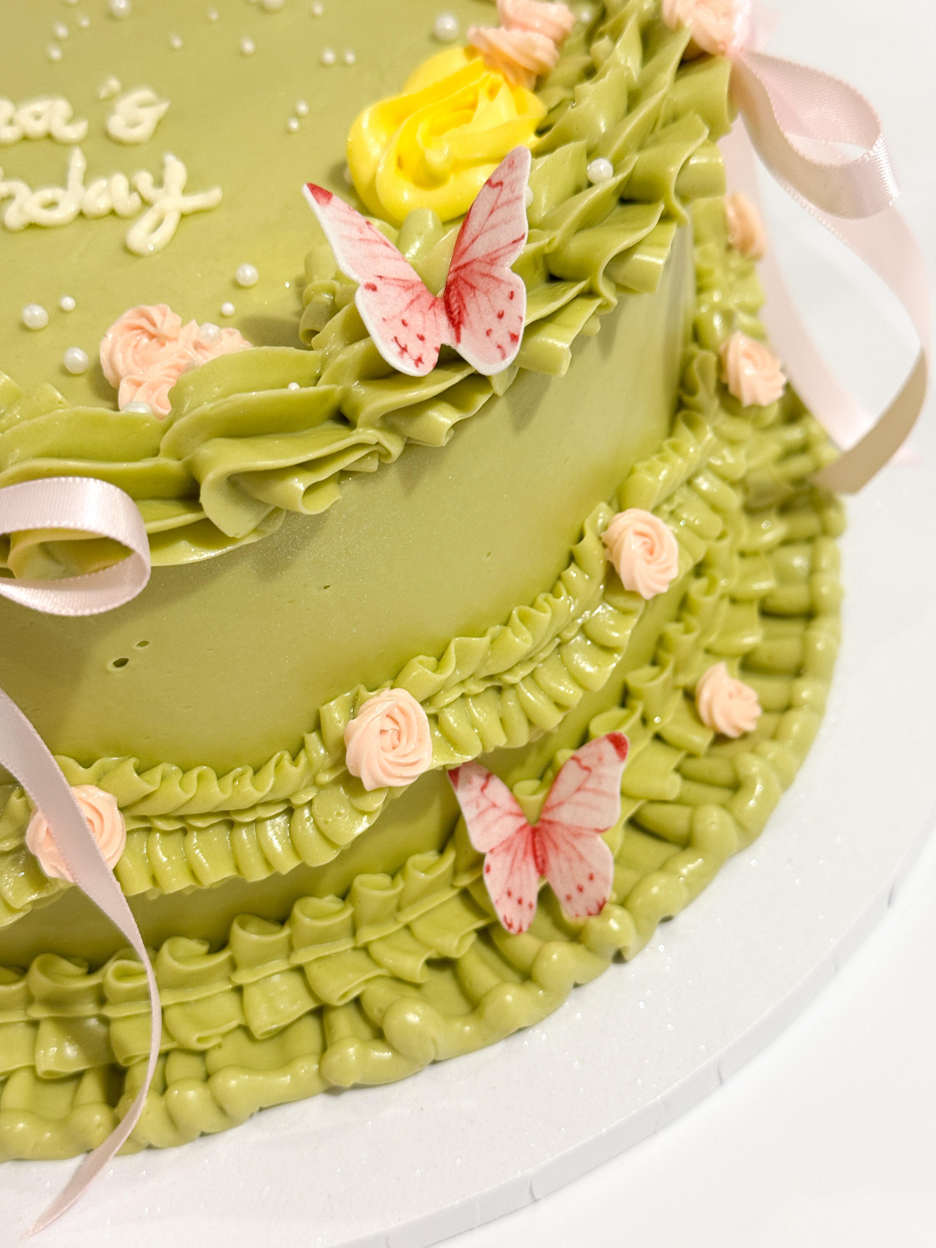 Confetti birthday cake with red sprinkles and candles